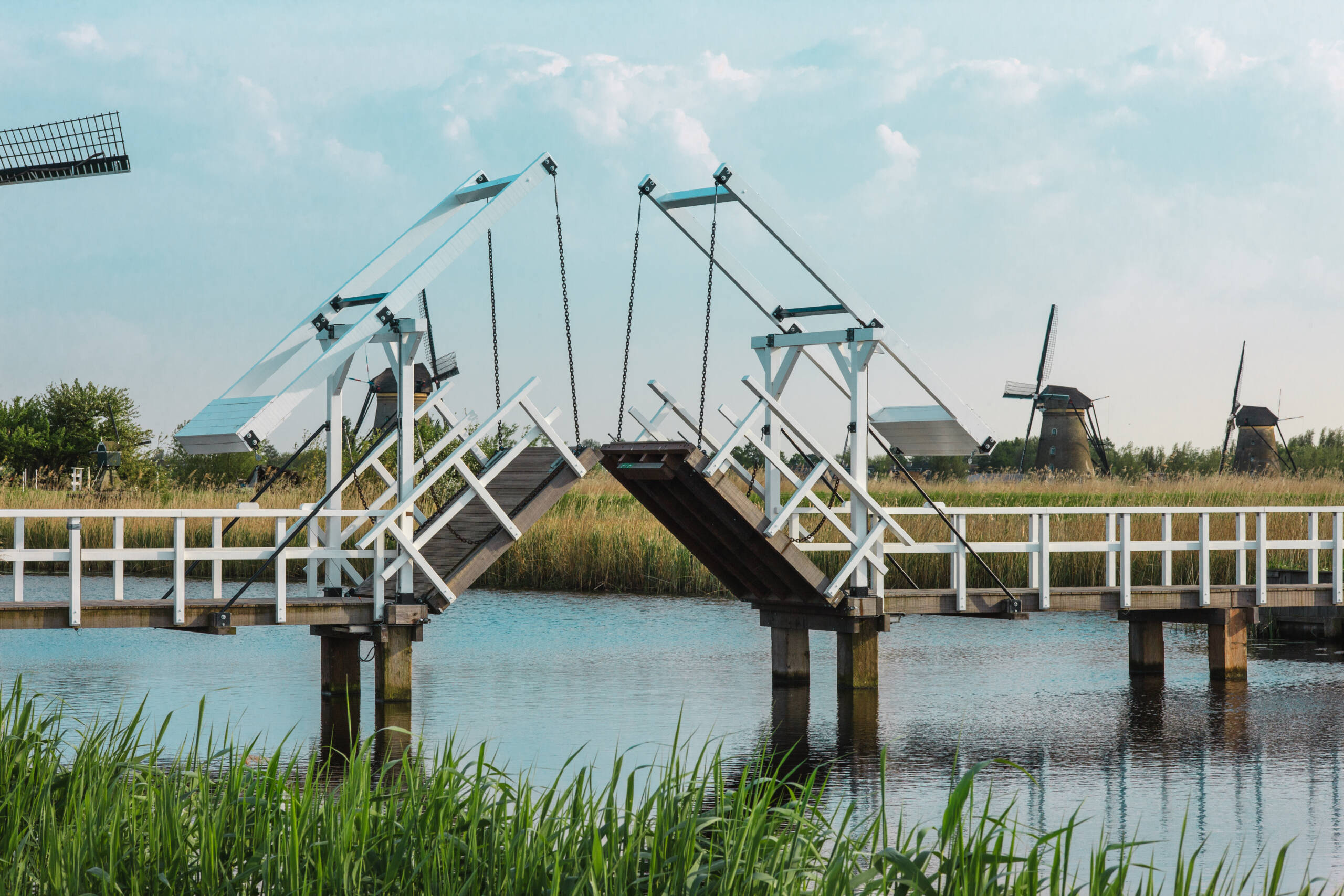 beautiful traditional dutch windmills near the water channels with drawbridge